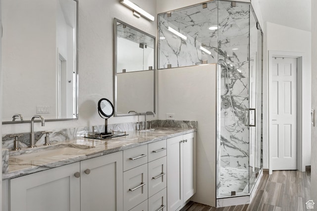 4673 Nelson Ct, Park City, UT 84098 - bathroom with a marble finish shower, double vanity, and wood finished floors