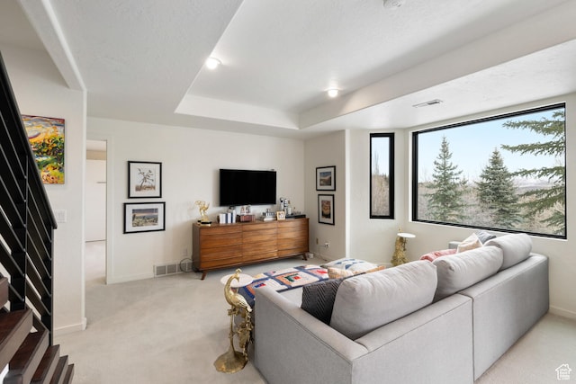 4673 Nelson Ct, Park City, UT 84098 - living room featuring light colored carpet, baseboards, a raised ceiling, and stairs