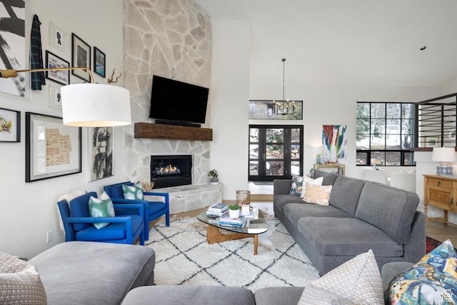 4673 Nelson Ct, Park City, UT 84098 - living area with a fireplace, a chandelier, and wood finished floors
