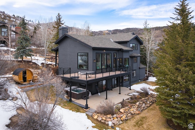 4673 Nelson Ct, Park City, UT 84098 - snow covered house featuring a patio area, a deck, and a chimney