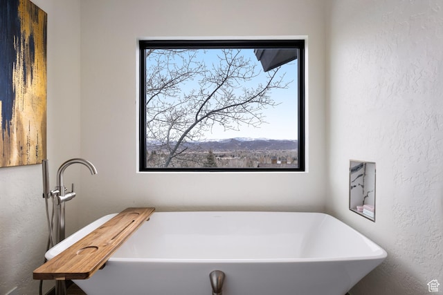 4673 Nelson Ct, Park City, UT 84098 - full bath with a textured wall and a freestanding tub
