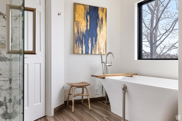4673 Nelson Ct, Park City, UT 84098 - bathroom featuring wood finished floors, a freestanding tub, and baseboards