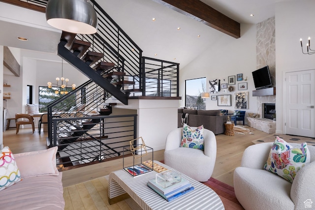 4673 Nelson Ct, Park City, UT 84098 - living area with a chandelier, hardwood / wood-style floors, stairway, beam ceiling, and high vaulted ceiling