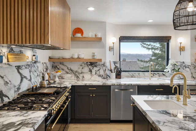 4673 Nelson Ct, Park City, UT 84098 - kitchen featuring stainless steel appliances, a sink, light stone counters, tasteful backsplash, and light wood finished floors