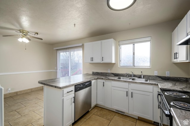 kitchen with a sink, white cabinets, a peninsula, and stainless steel dishwasher
