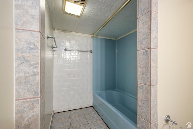 full bath featuring tile patterned floors and bathtub / shower combination