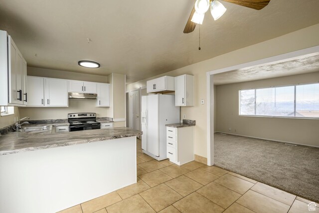 kitchen featuring a sink, under cabinet range hood, white fridge with ice dispenser, stainless steel electric range oven, and light colored carpet