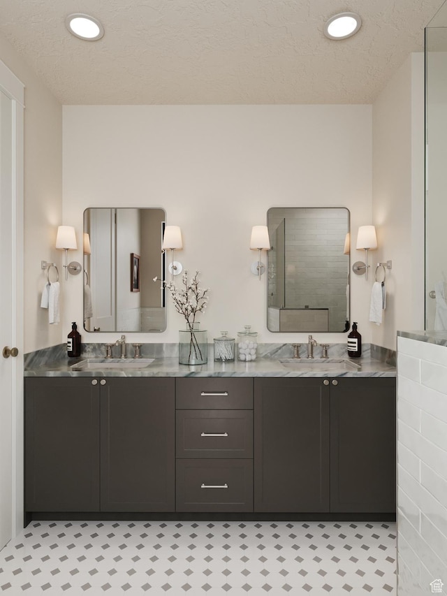 439 S 7900 E Unit 11, Huntsville, UT 84317 - bathroom with double vanity, recessed lighting, and a textured ceiling