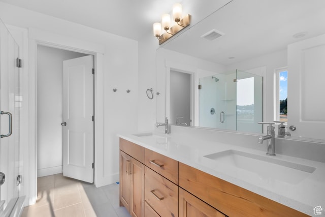 full bathroom with double vanity, visible vents, a shower stall, and a sink