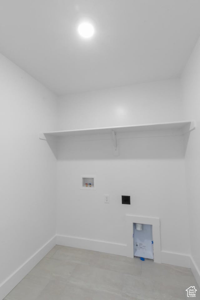 clothes washing area featuring electric dryer hookup, baseboards, hookup for a washing machine, and laundry area