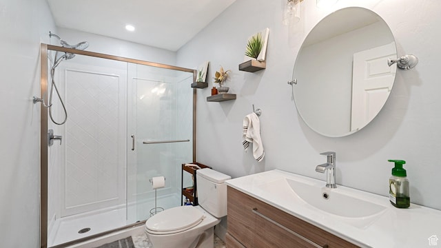 full bathroom featuring vanity, a shower stall, toilet, and recessed lighting