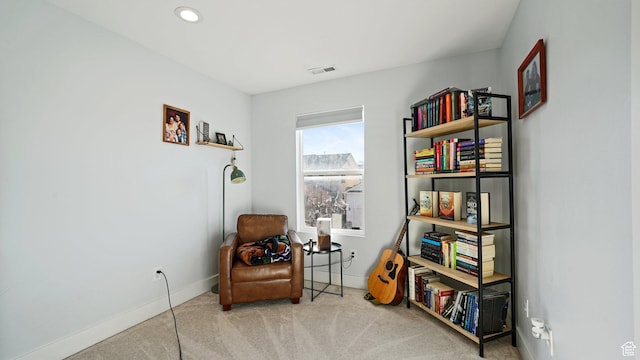 living area with recessed lighting, baseboards, visible vents, and carpet floors
