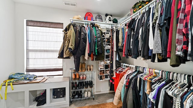 spacious closet featuring visible vents
