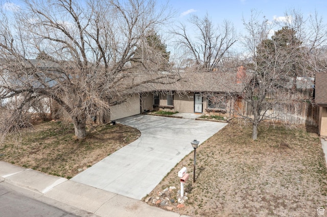 view of front of property with stucco siding and driveway