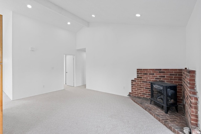 living area featuring carpet, high vaulted ceiling, a wood stove, recessed lighting, and beamed ceiling