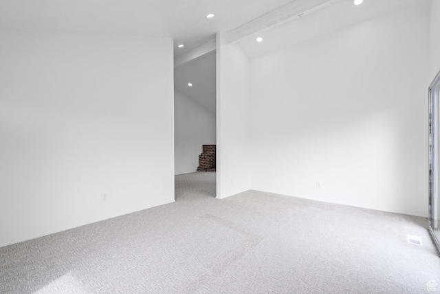 unfurnished room featuring recessed lighting, vaulted ceiling with beams, and carpet flooring