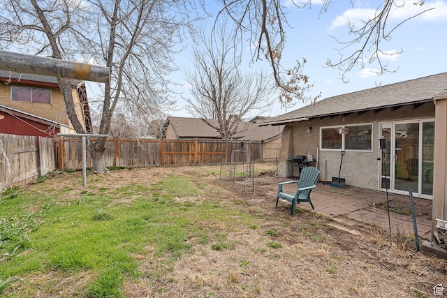 view of yard featuring a patio area and a fenced backyard