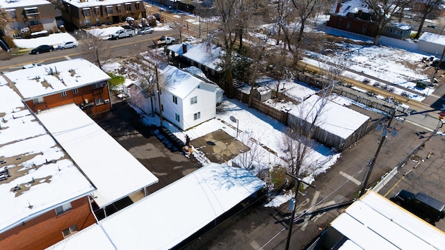 snowy aerial view featuring a residential view