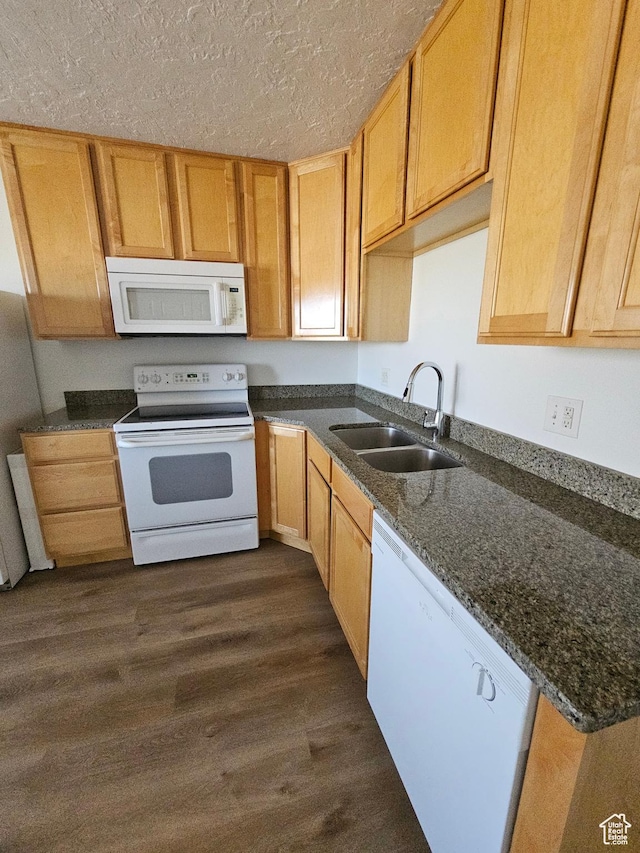 3673 S 2200 W Unit 15, West Valley City, UT 84119 - kitchen with dark wood-type flooring, dark stone counters, white appliances, a textured ceiling, and a sink
