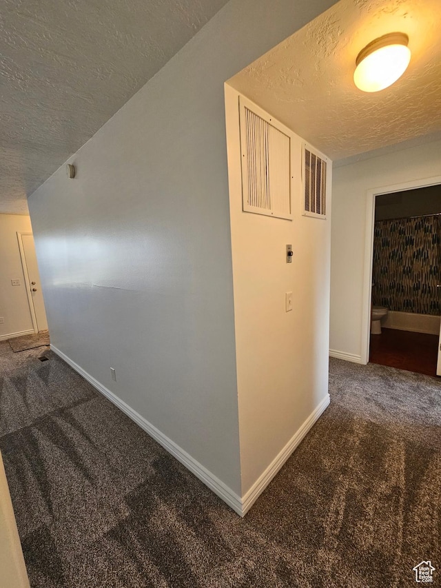 3673 S 2200 W Unit 15, West Valley City, UT 84119 - corridor featuring baseboards, carpet floors, and a textured ceiling