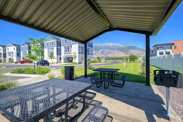 view of patio / terrace with a mountain view and a residential view