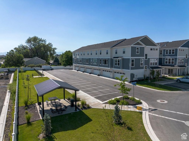 uncovered parking lot with a residential view