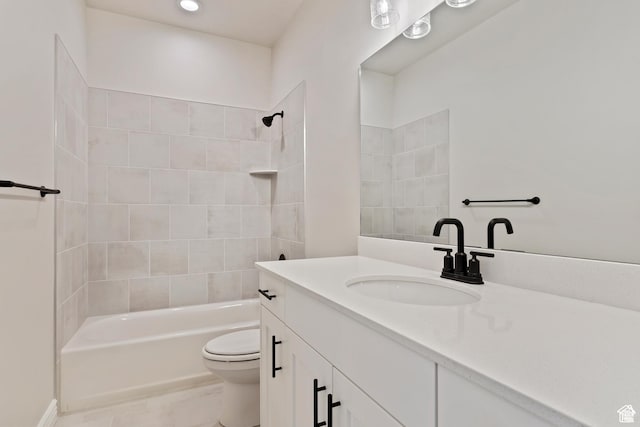full bathroom featuring toilet, vanity, and shower / bathing tub combination