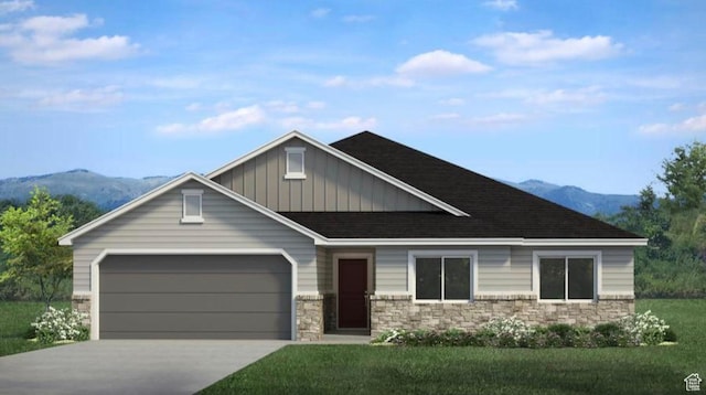 craftsman-style house featuring an attached garage, stone siding, board and batten siding, driveway, and a mountain view