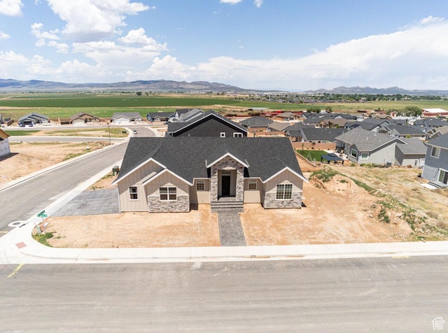 502 S Foundation Trl, Cedar City, UT 84720 - view of front of property with stone siding, board and batten siding, a mountain view, and a residential view