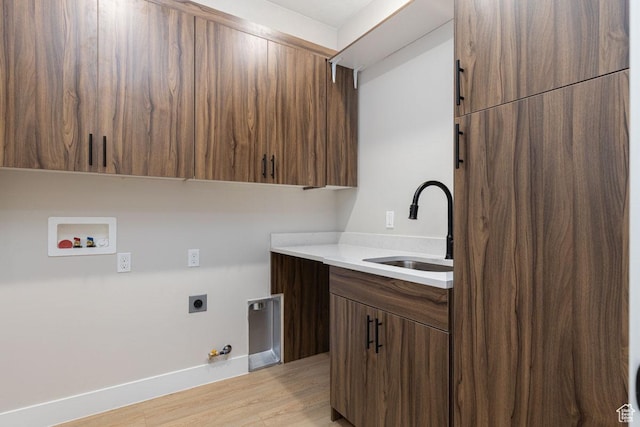 502 S Foundation Trl, Cedar City, UT 84720 - laundry room featuring gas dryer hookup, cabinet space, hookup for an electric dryer, light wood-type flooring, and washer hookup