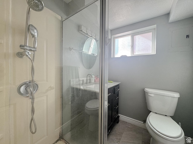 3140 S 4140 W, West Valley City, UT 84120 - bathroom with toilet, a walk in shower, a textured ceiling, baseboards, and vanity