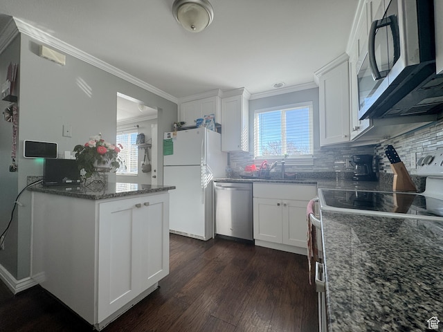 3140 S 4140 W, West Valley City, UT 84120 - kitchen with stainless steel appliances, dark wood finished floors, ornamental molding, and white cabinets