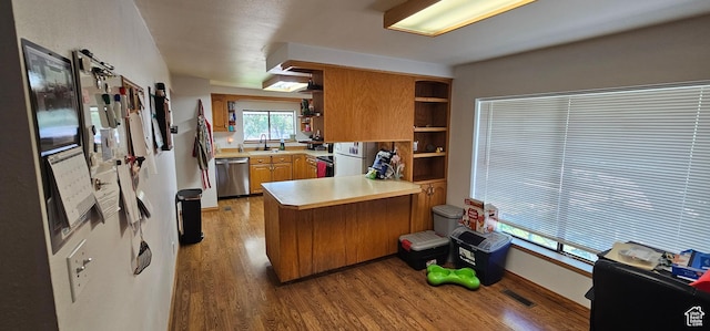 1433 W 2060 N, Helper, UT 84526 - kitchen with stainless steel dishwasher, a peninsula, open shelves, wood finished floors, and light countertops