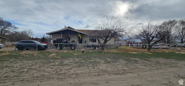 view of front of home featuring fence