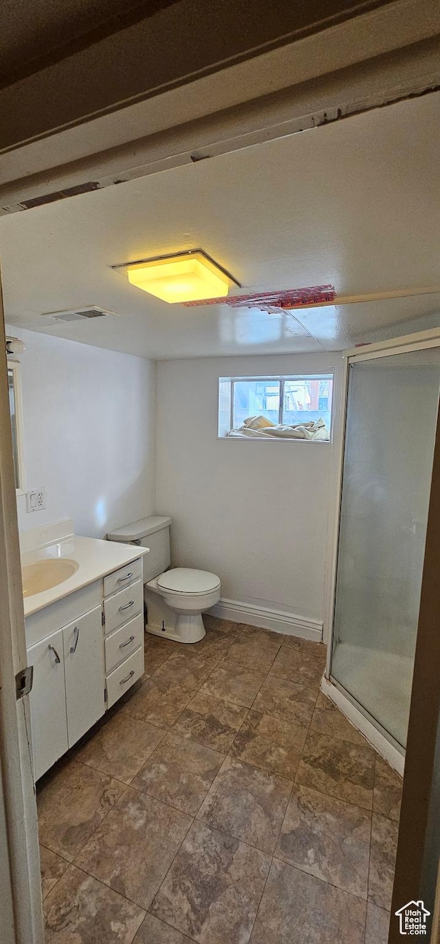 1433 W 2060 N, Helper, UT 84526 - bathroom featuring vanity, a shower stall, and toilet