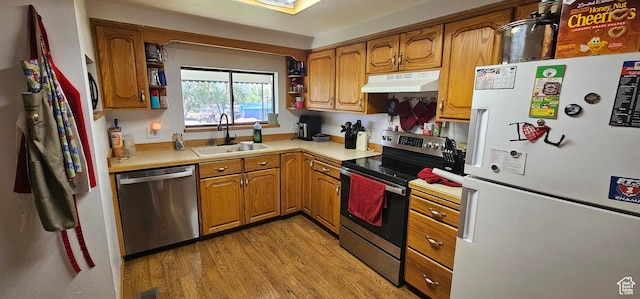 1433 W 2060 N, Helper, UT 84526 - kitchen with appliances with stainless steel finishes, under cabinet range hood, brown cabinets, and open shelves
