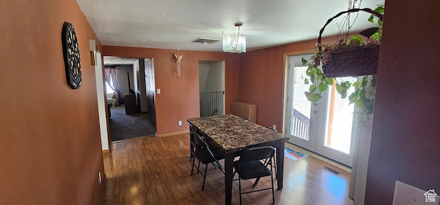 1433 W 2060 N, Helper, UT 84526 - dining room featuring healthy amount of natural light, wood finished floors, and a chandelier