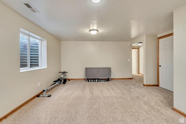 interior space with visible vents, carpet flooring, and baseboards