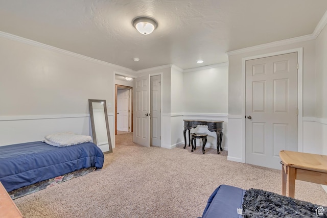 bedroom with crown molding, carpet, and baseboards