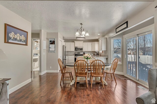 dining area featuring an inviting chandelier, baseboards, dark wood-style flooring, and a textured ceiling