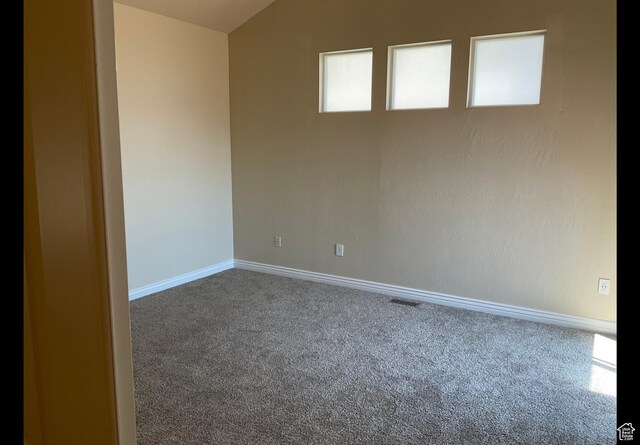 2843 W Pine Cone Ln N, Lehi, UT 84043 - empty room featuring carpet flooring, lofted ceiling, and baseboards
