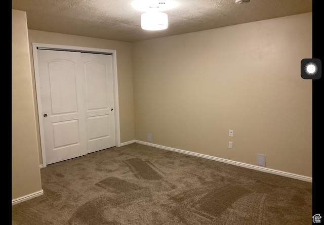 2843 W Pine Cone Ln N, Lehi, UT 84043 - unfurnished bedroom with a closet, baseboards, a textured ceiling, and carpet flooring