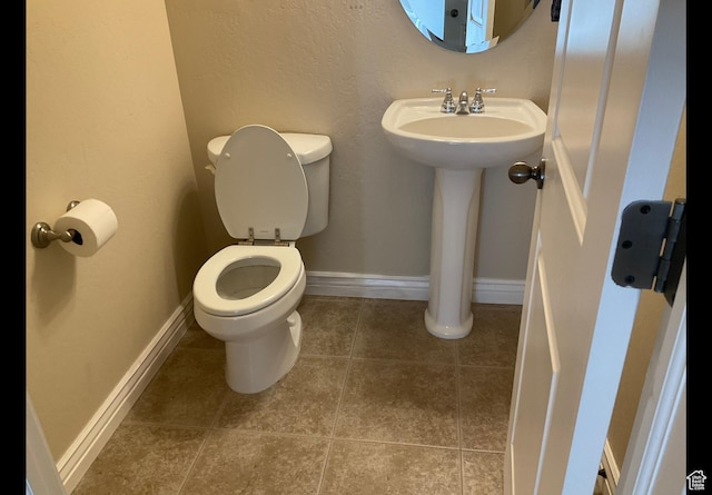 2843 W Pine Cone Ln N, Lehi, UT 84043 - half bathroom with a sink, baseboards, toilet, and tile patterned flooring