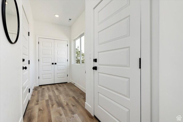 971 W 1700 S Unit 114, Salt Lake City, UT 84104 - doorway to outside featuring visible vents, baseboards, and wood finished floors
