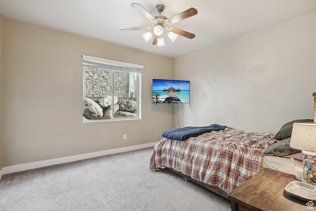 bedroom with baseboards, a ceiling fan, and carpet
