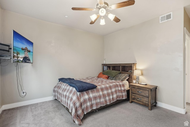 carpeted bedroom with ceiling fan, baseboards, and visible vents