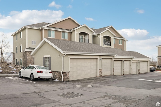 view of front of house with stone siding and stucco siding