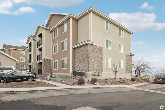 view of property featuring central AC unit