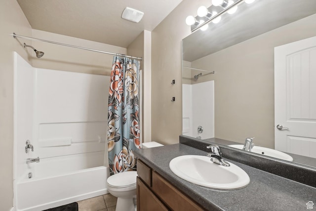 bathroom featuring tile patterned floors, shower / bath combination with curtain, vanity, and toilet