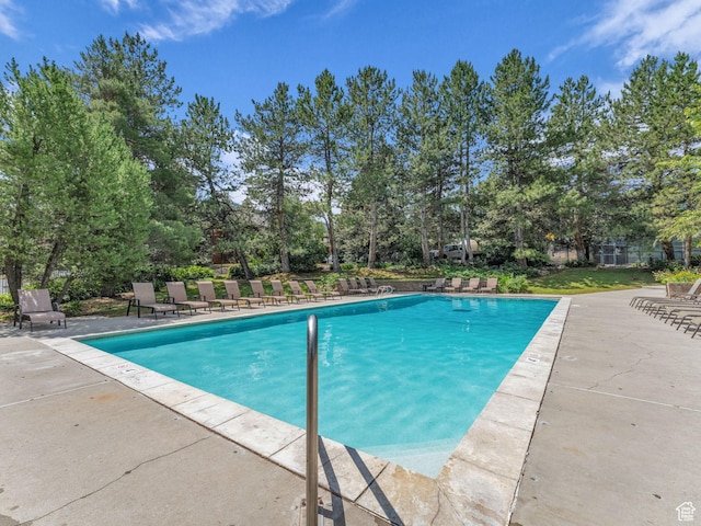 2025 Canyons Resort Dr Unit R8, Park City, UT 84060 - swimming pool with a patio and view of wooded area